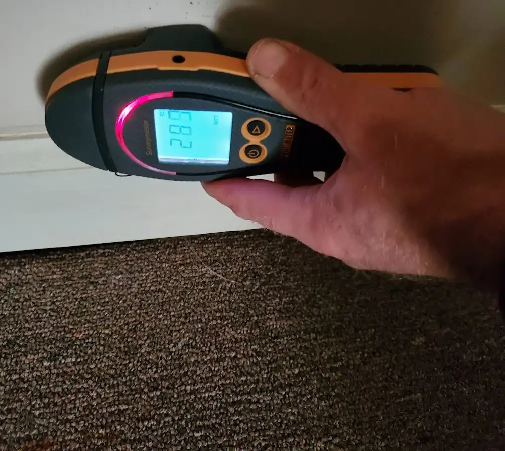 Moisture detection at baseboard during Storm Damage Restoration in Pismo Beach